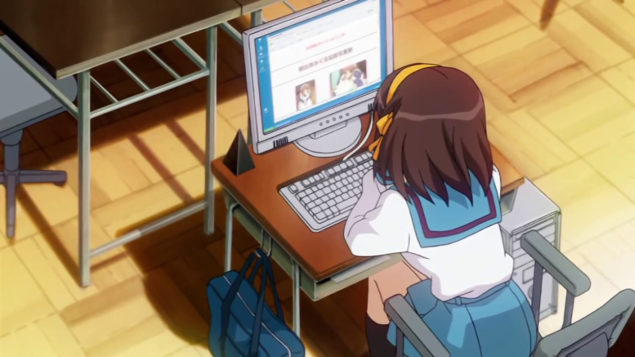 Haruhi browses the SOS Brigade website on the club room computer