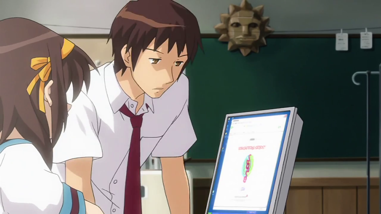 Kyon leans over Haruhi's shoulder as she looks at the SOS Brigade website again in the club room